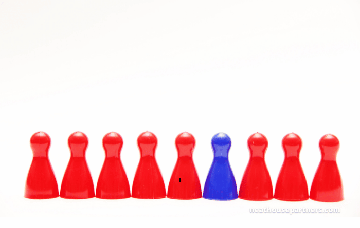 Red coloured counters lined up with one blue counter 